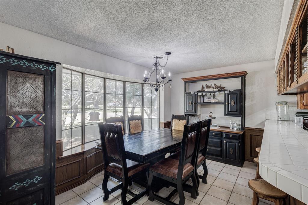 10492 Strittmatter Road Pilot Point, TX 76258 - Photo 5 of 9 a view of a dining room with furniture window and outside view