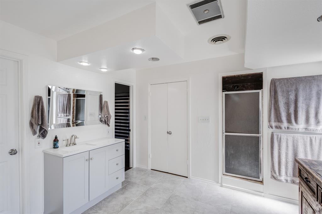 10492 Strittmatter Road Pilot Point, TX 76258 - Photo 6 of 9 a bathroom with a sink and mirror