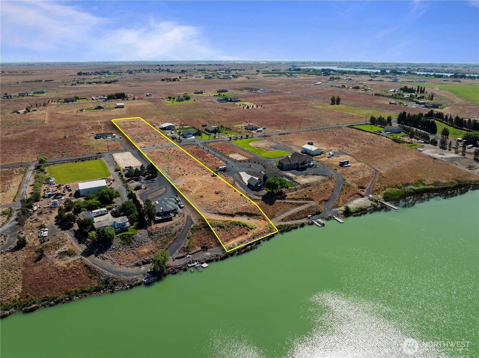 7416 Stonecrest Road Northeast Moses Lake, WA 98837 - Photo 4 of 12 an aerial view of a house with a garden