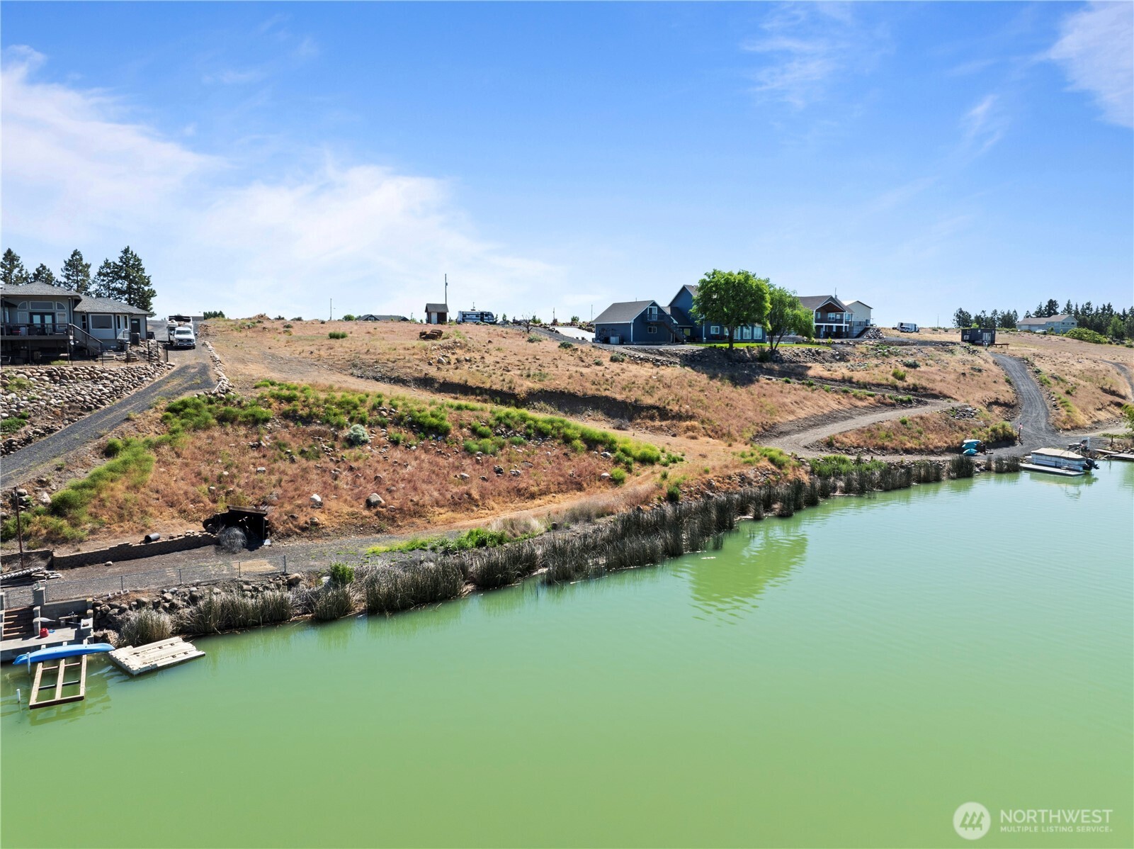7416 Stonecrest Road Northeast Moses Lake, WA 98837 - Photo 5 of 12 a view of a lake with outdoor space