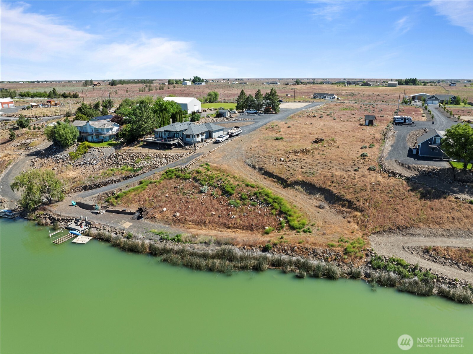 7416 Stonecrest Road Northeast Moses Lake, WA 98837 - Photo 10 of 12 an aerial view of beach and residential houses with outdoor space