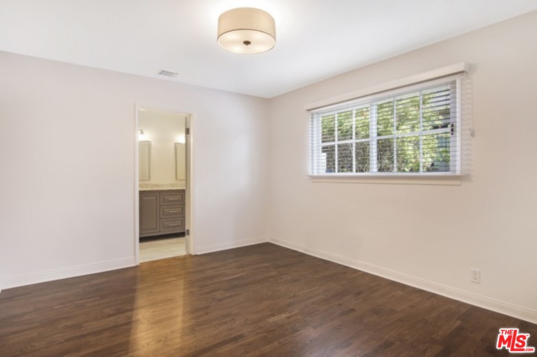 1209 Appleton Way Venice, CA 90291 - Photo 12 of 15 an empty room with wooden floor and windows