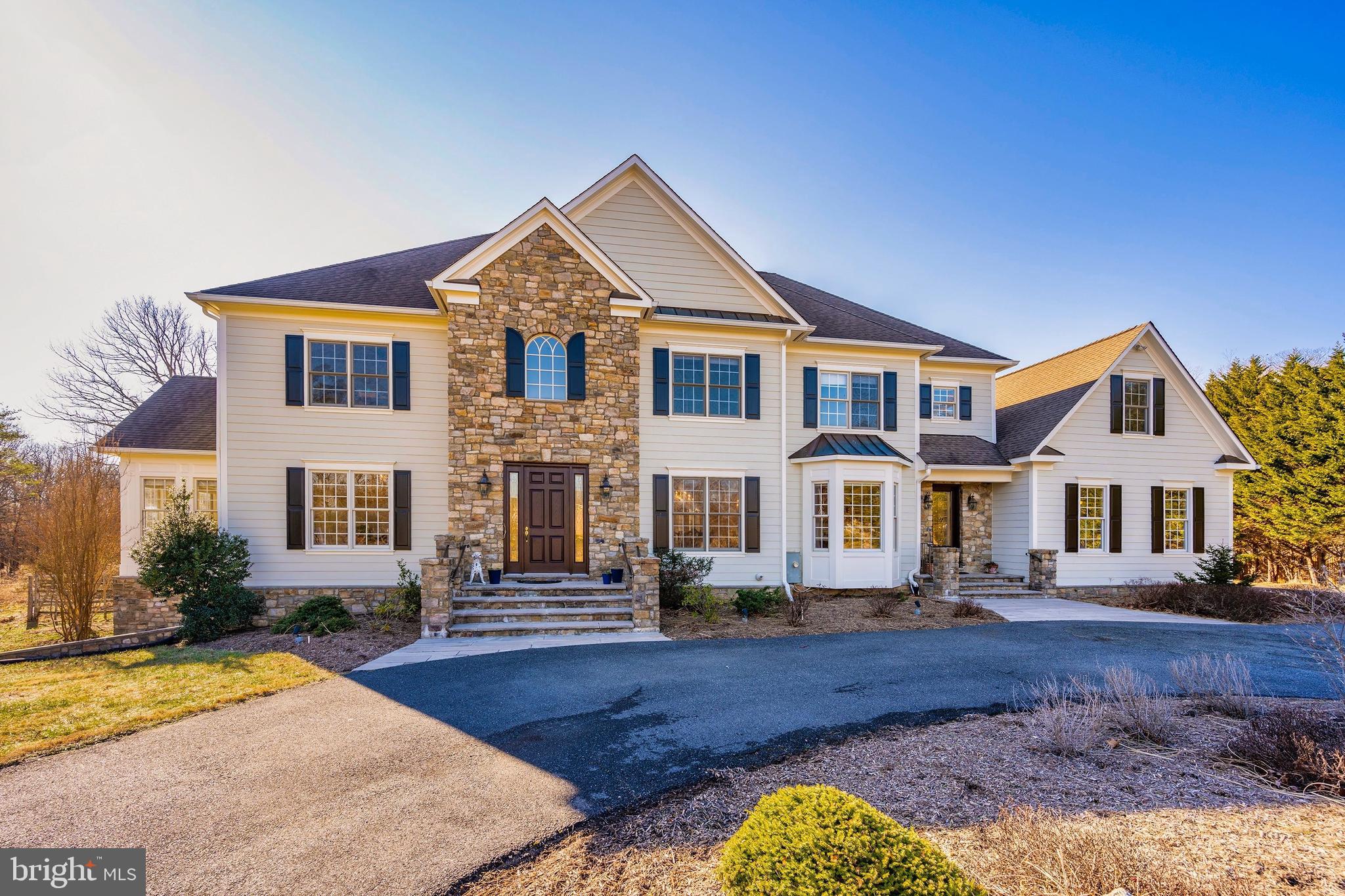11340 Albermyrtle Road Potomac, MD 20854 - Photo 1 of 42 Front of home with circular driveway