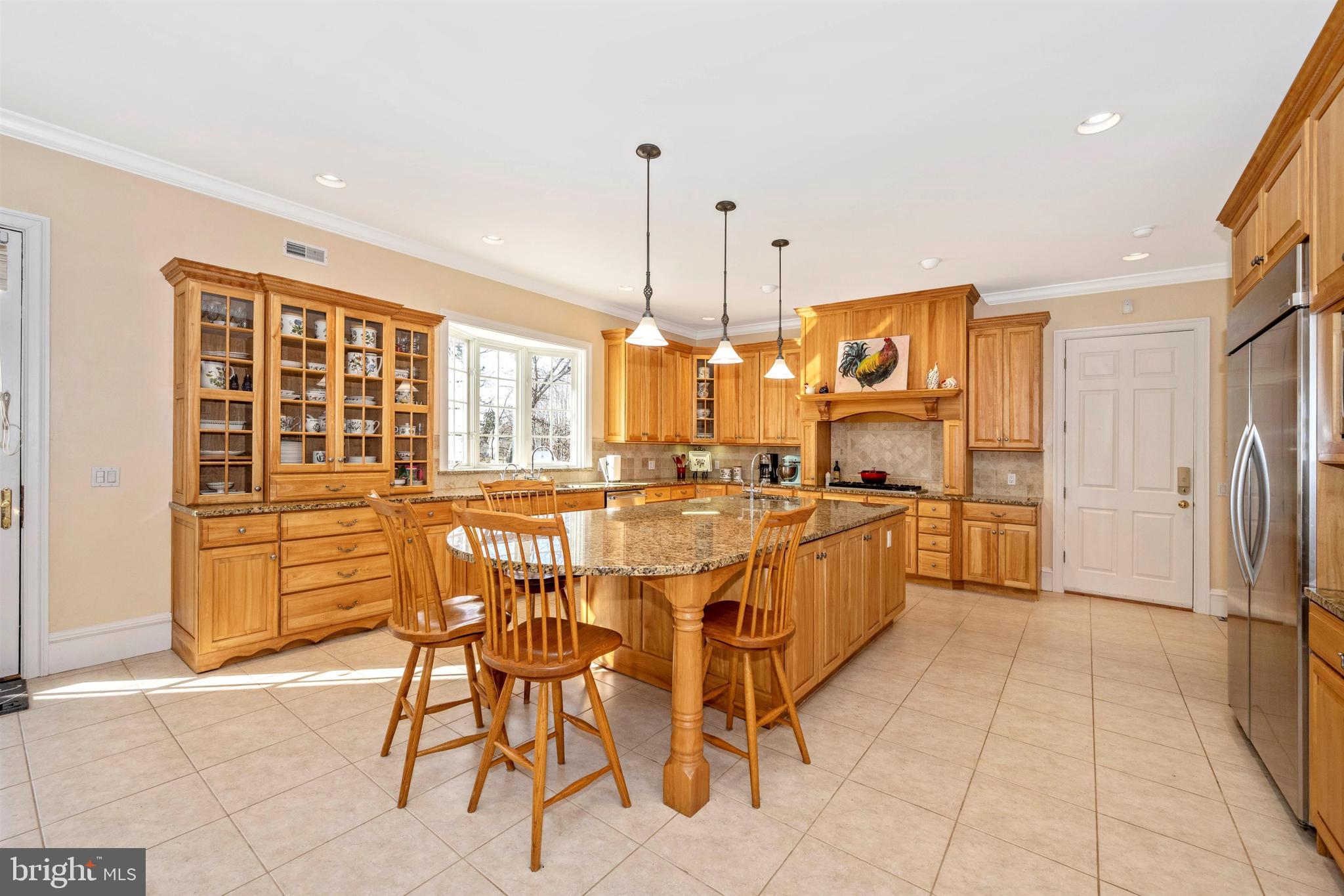 11340 Albermyrtle Road Potomac, MD 20854 - Photo 7 of 42 Kitchen with Breakfast Bar