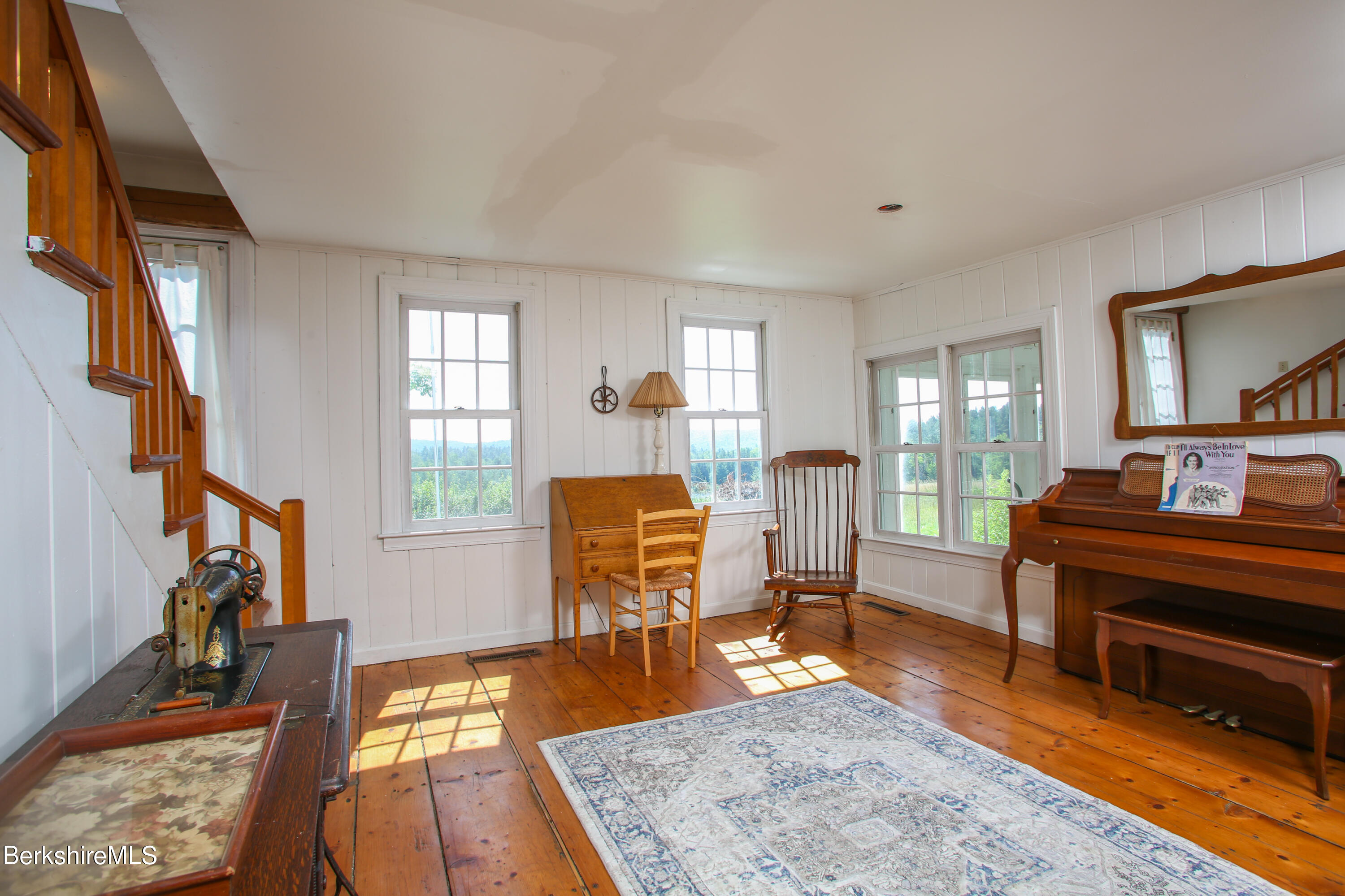 1256 East Windsor Road Windsor, MA 01270 - Photo 16 of 34 a living room with furniture and a flat screen tv with wooden floor