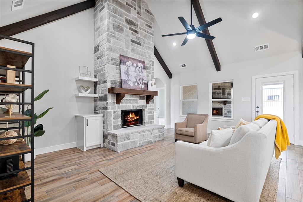 a living room with furniture and a fireplace