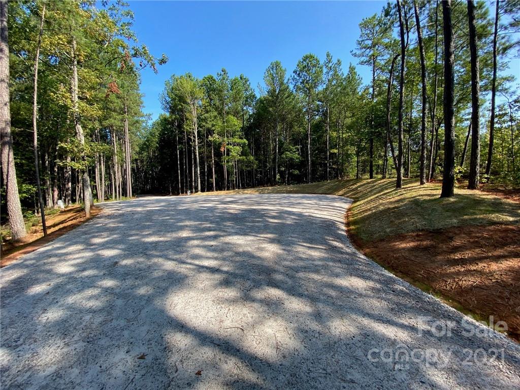 2 Pine Forest Drive, Unit TRACT B Lancaster, SC 29720 - Photo 2 of 8 a big yard with trees in front of it