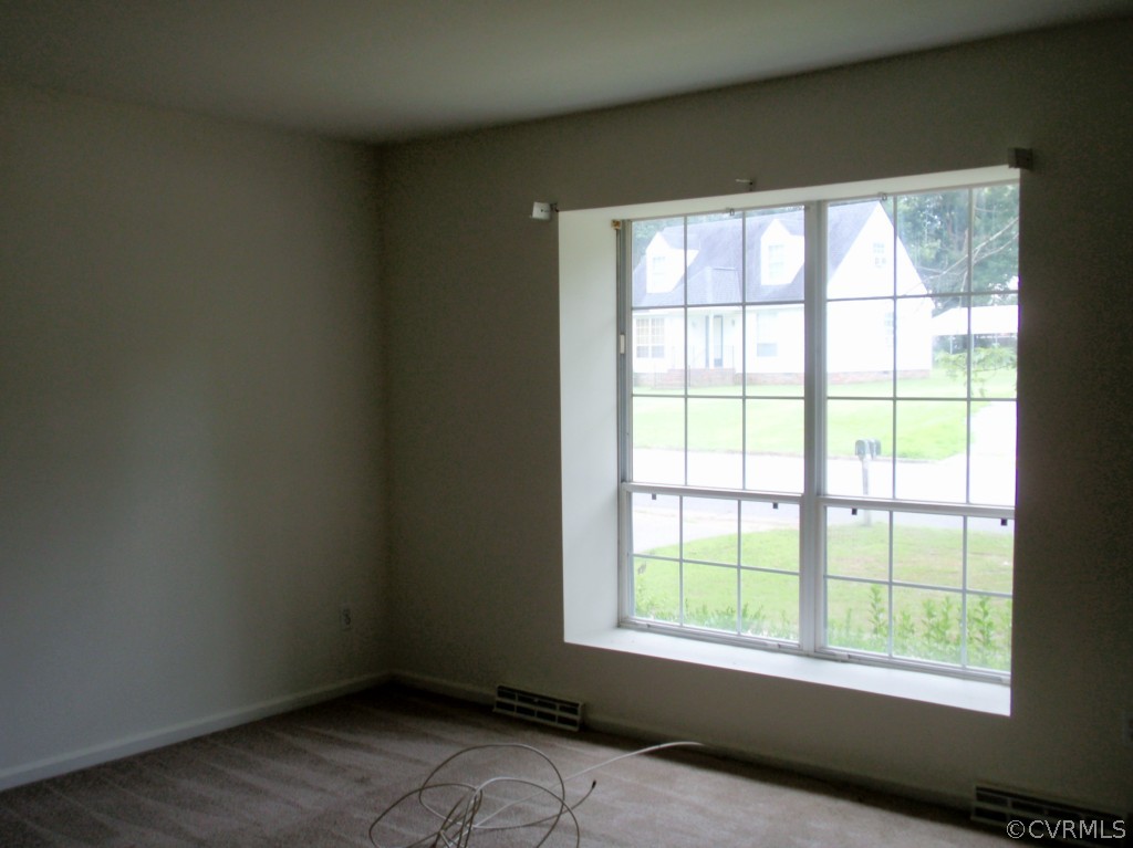 6028 Barrister Road Chesterfield, VA 23832 - Photo 2 of 8 an empty room with a window