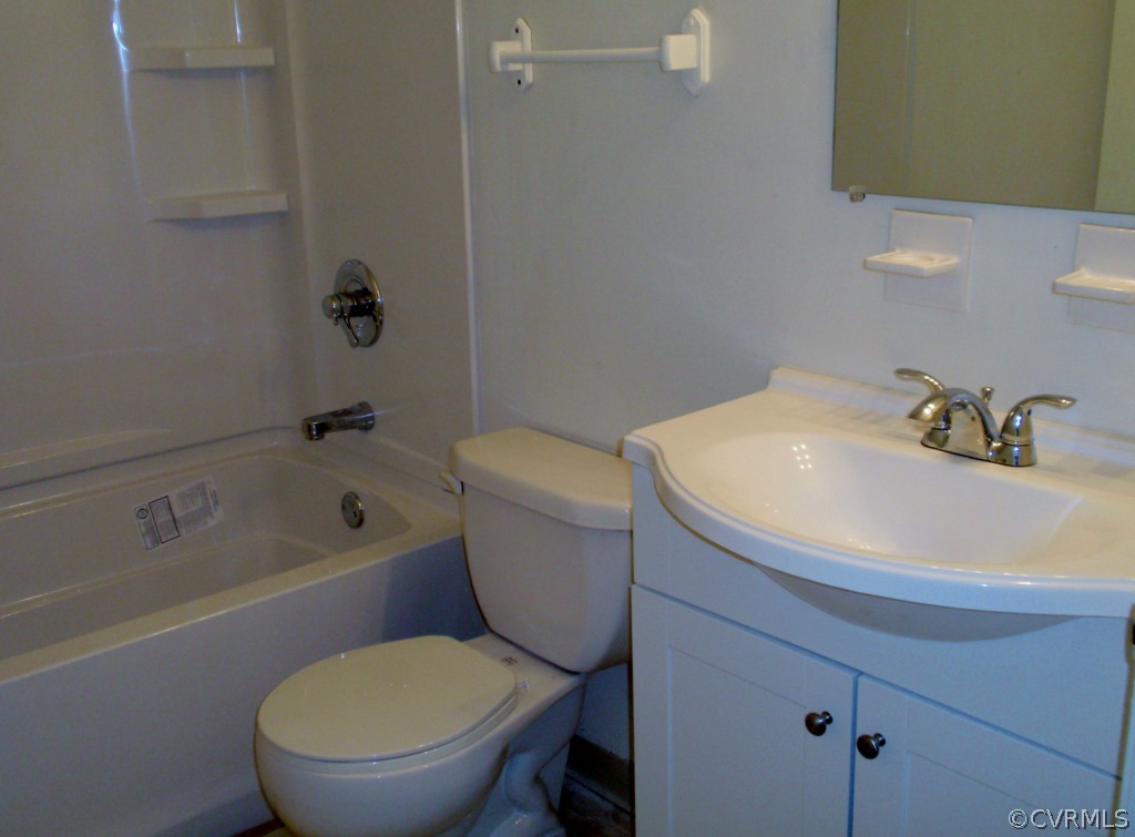 6028 Barrister Road Chesterfield, VA 23832 - Photo 7 of 8 a white toilet sitting next to a bath tub