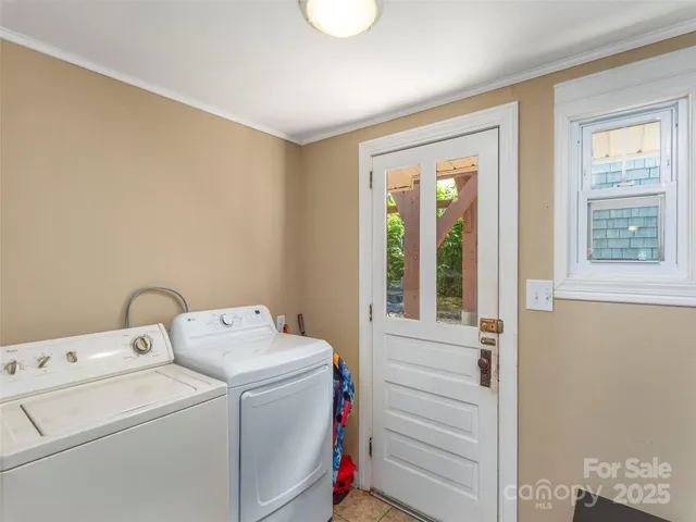 a view of storage and utility room with washer and dryer