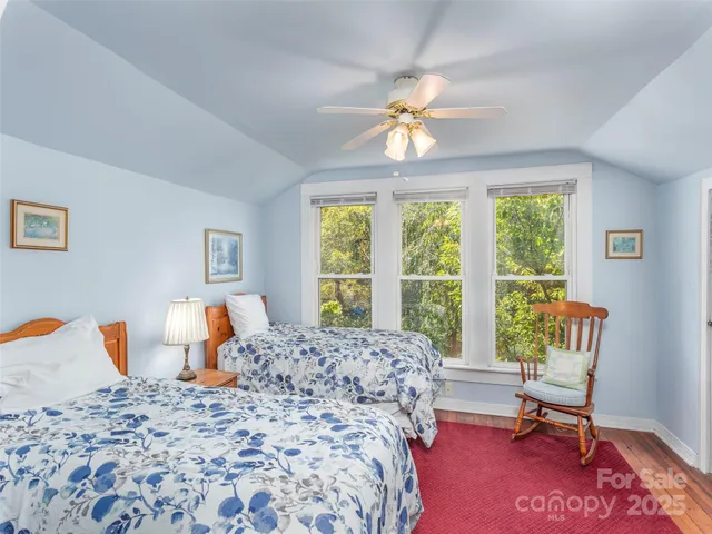 a bedroom with a bed and a table