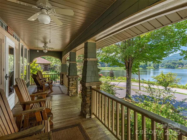 a view of a porch with chairs and backyard