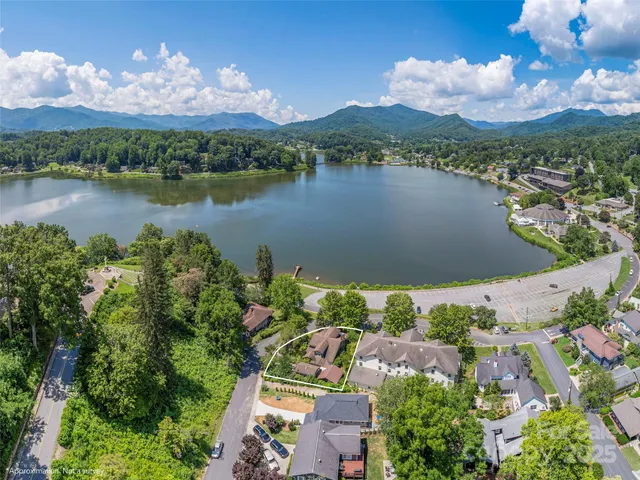 an aerial view of a city with lake view