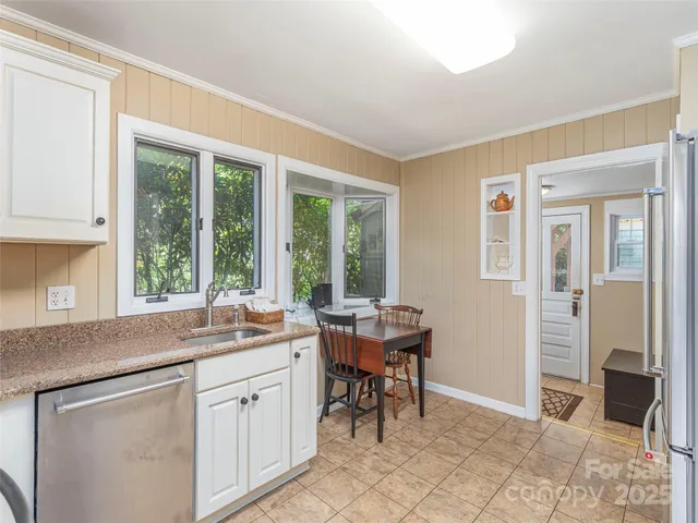 a kitchen with a sink and cabinets