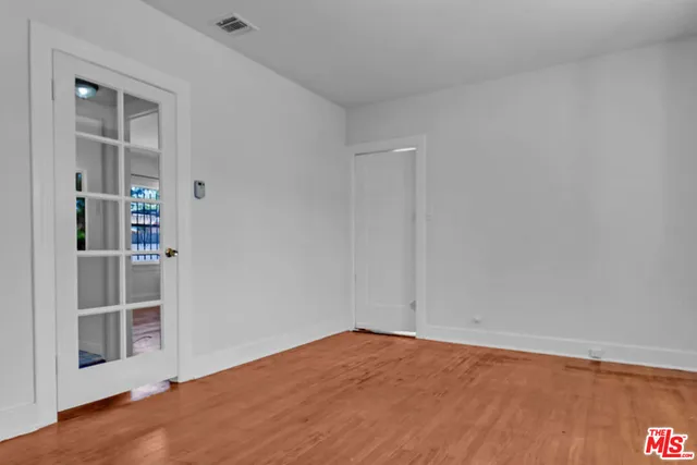 an empty room with entrance and door