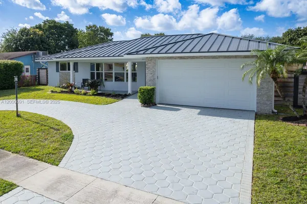 a view of a house with swimming pool and porch with furniture