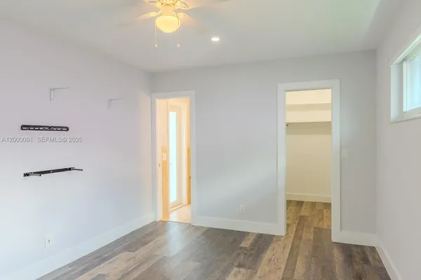 a bathroom with a shower and a toilet