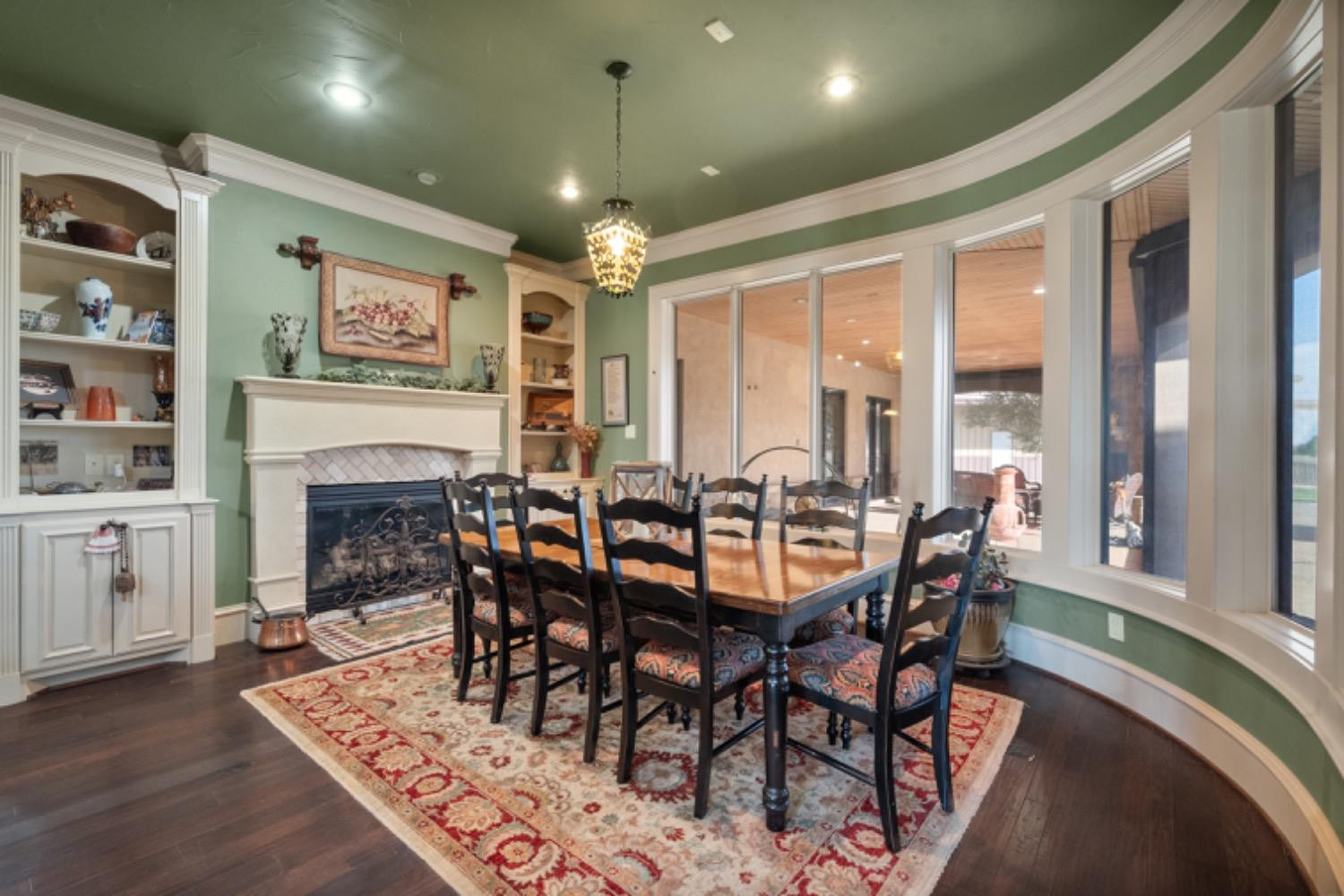 5631 Woodrow Road Lubbock, TX 79424 - Photo 21 of 50 a view of a dining room with furniture window and wooden floor