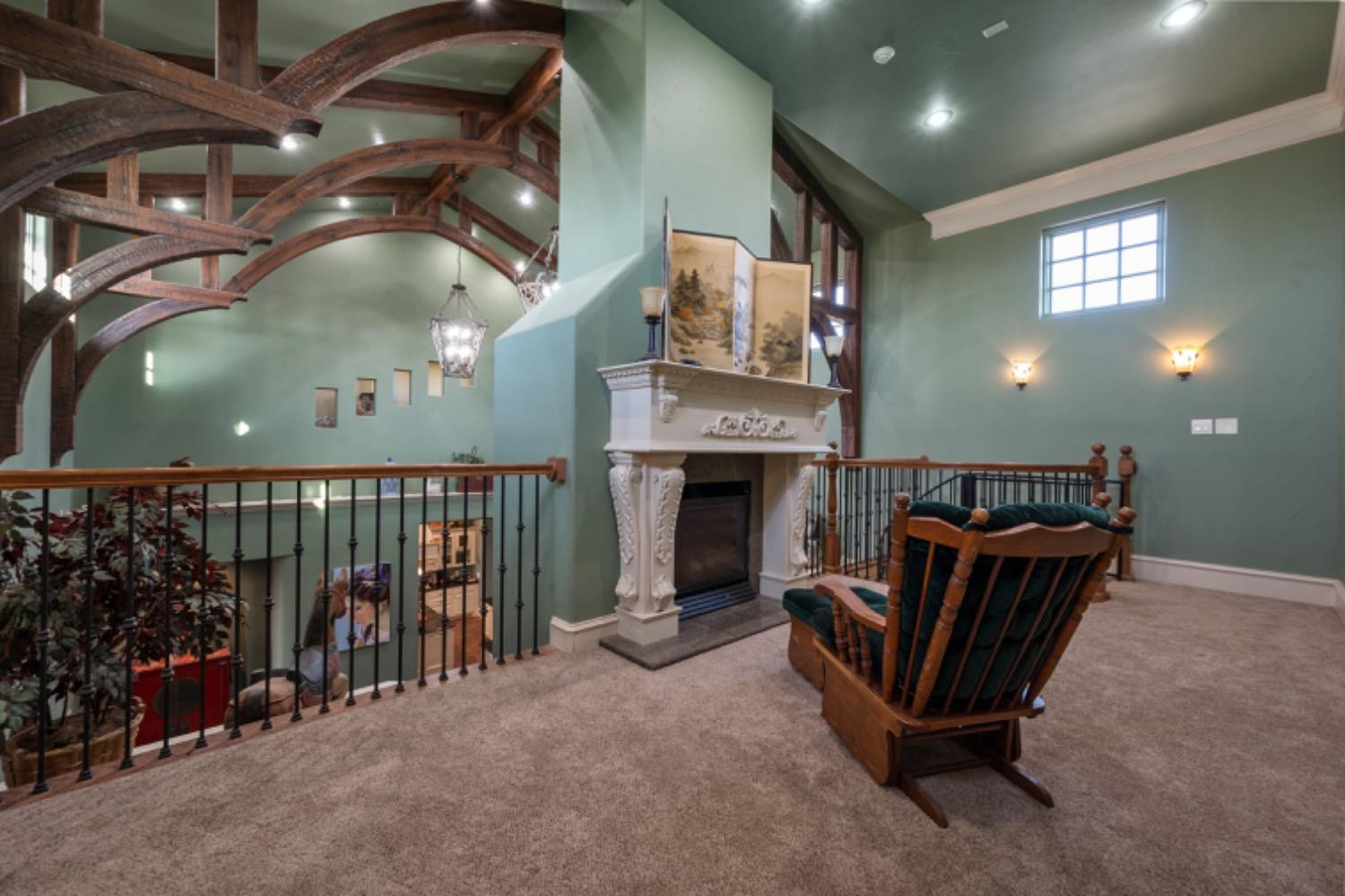 5631 Woodrow Road Lubbock, TX 79424 - Photo 23 of 50 a living room with furniture and a fireplace
