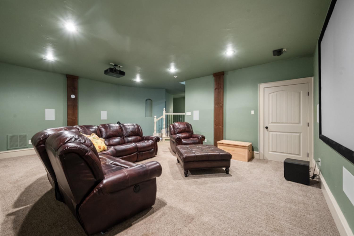 5631 Woodrow Road Lubbock, TX 79424 - Photo 29 of 50 a living room with furniture a fireplace and a flat screen tv