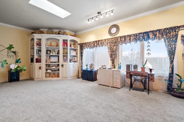 a view of a livingroom with furniture and window
