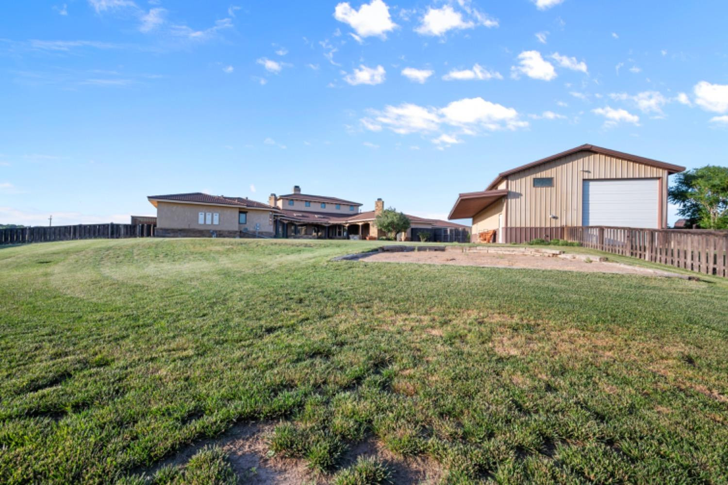 5631 Woodrow Road Lubbock, TX 79424 - Photo 45 of 50 a view of a house with a big yard and large tree