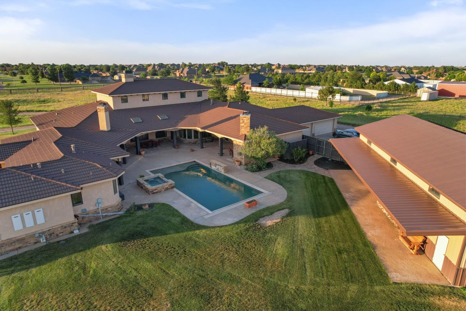 5631 Woodrow Road Lubbock, TX 79424 - Photo 48 of 50 an aerial view of a house with a lake view