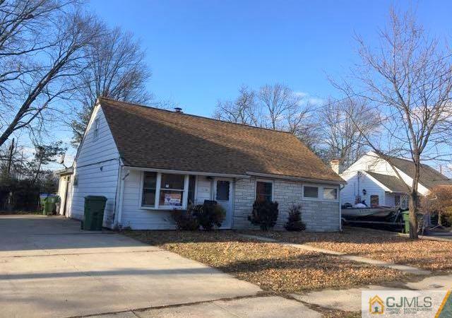 13 Sturgis Road Edison, NJ 08817 - Photo 1 of 22 a front view of a house with a yard