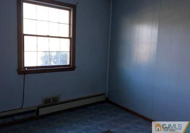 13 Sturgis Road Edison, NJ 08817 - Photo 13 of 22 an empty room with a empty space and window