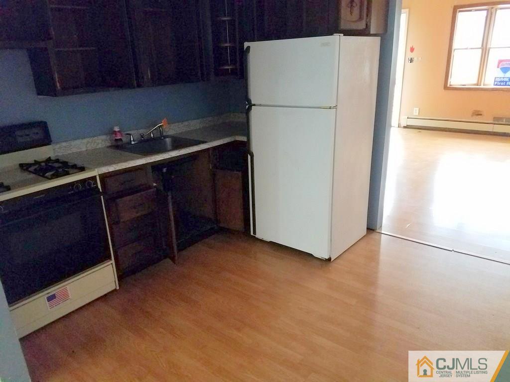13 Sturgis Road Edison, NJ 08817 - Photo 17 of 22 a kitchen with a refrigerator and a stove