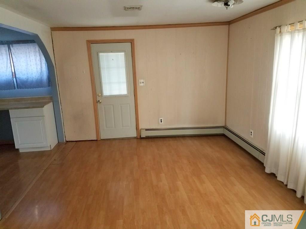 13 Sturgis Road Edison, NJ 08817 - Photo 20 of 22 wooden floor in an empty room with a window