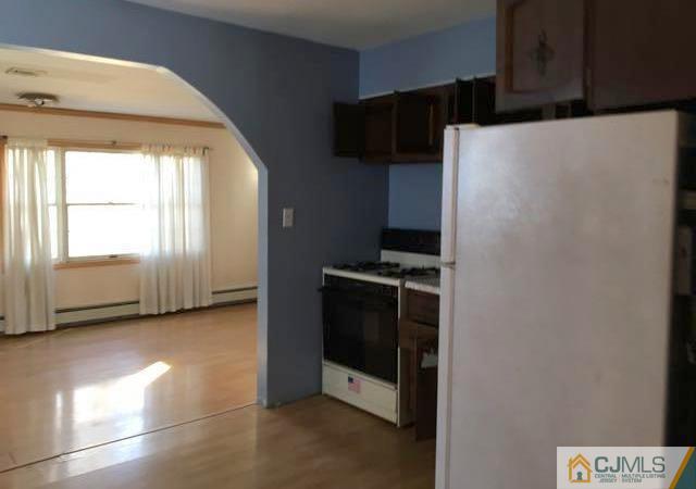 13 Sturgis Road Edison, NJ 08817 - Photo 6 of 22 a kitchen with stainless steel appliances a refrigerator and a stove