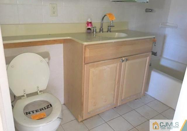 13 Sturgis Road Edison, NJ 08817 - Photo 8 of 22 a bathroom with a sink and a mirror