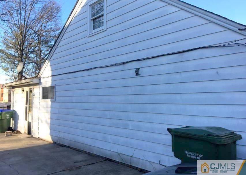 13 Sturgis Road Edison, NJ 08817 - Photo 9 of 22 a view of a wooden door and brick wall