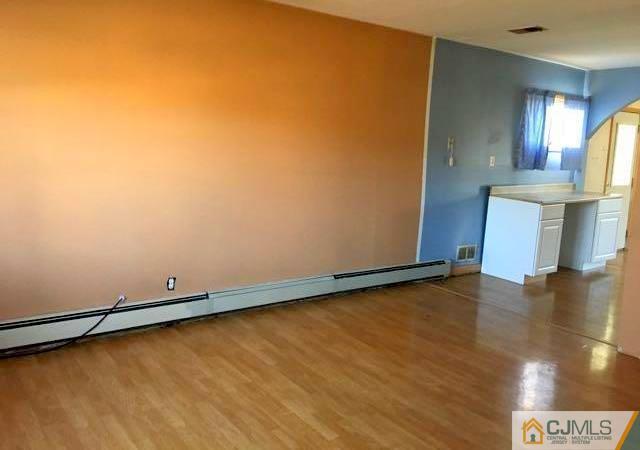 13 Sturgis Road Edison, NJ 08817 - Photo 10 of 22 a view of a room with wooden floor
