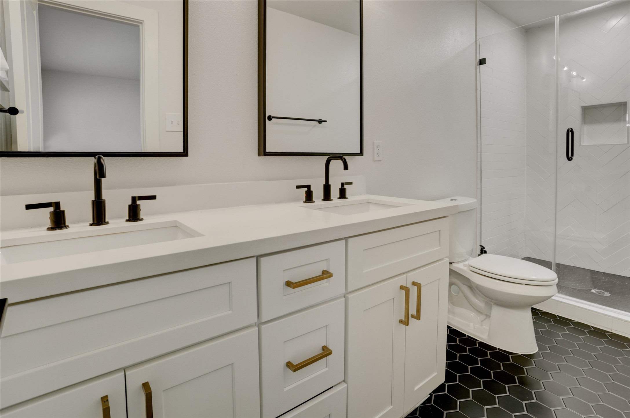 5514 Indigo Street Houston, TX 77096 - Photo 15 of 22 a bathroom with a toilet sink and mirror