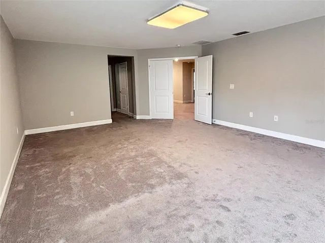 an empty room with closet area