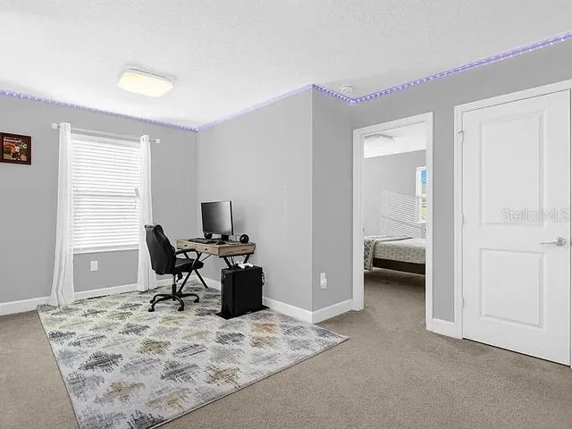 a workspace with furniture and a window