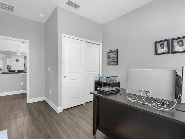 a room with furniture and wooden floor