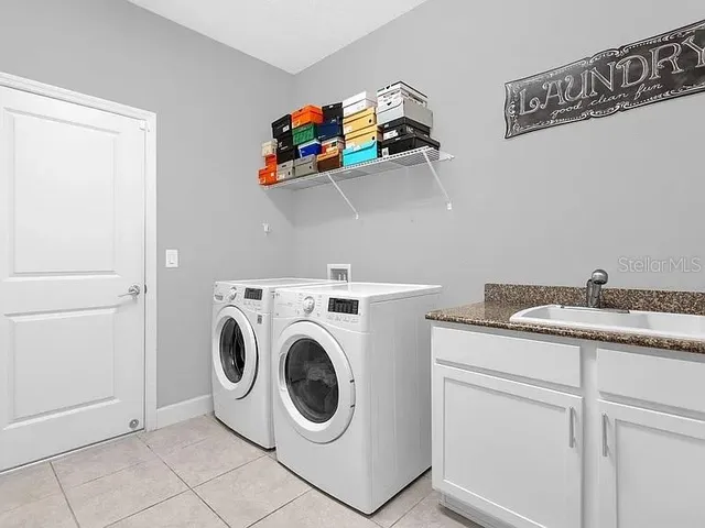 a utility room with dryer and washer