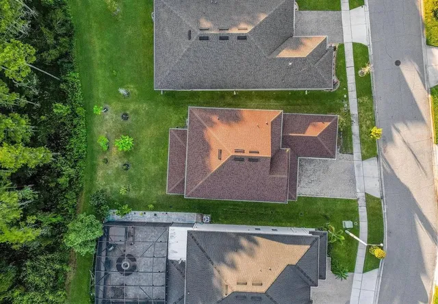 an aerial view of a house with a garden and plants