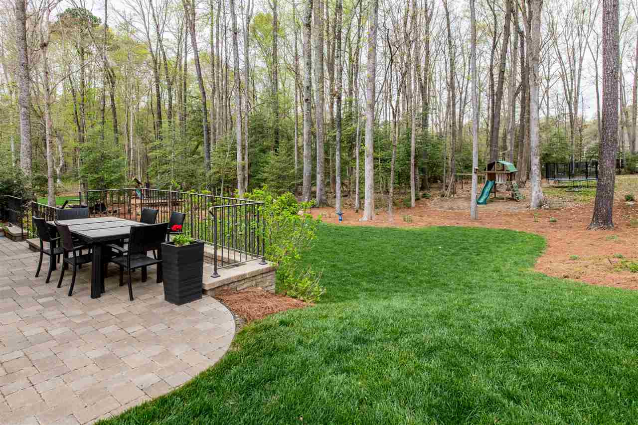 12221 Upper Creek Way Raleigh, NC 27614 - Photo 24 of 30 You can't beat the views and size of this backyard. Plenty of room for playing, running, exploring, and entertaining! Backyard