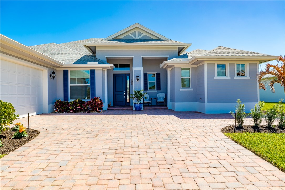 105 Night Hawk Way Sebastian, FL 32958 - Photo 2 of 36 a view of a house with potted plants