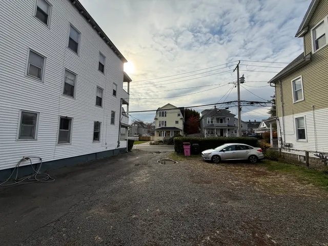a view of street with parked cars