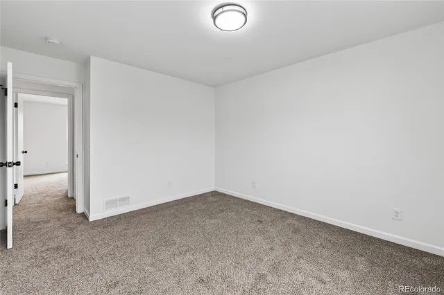 an empty room with a bench