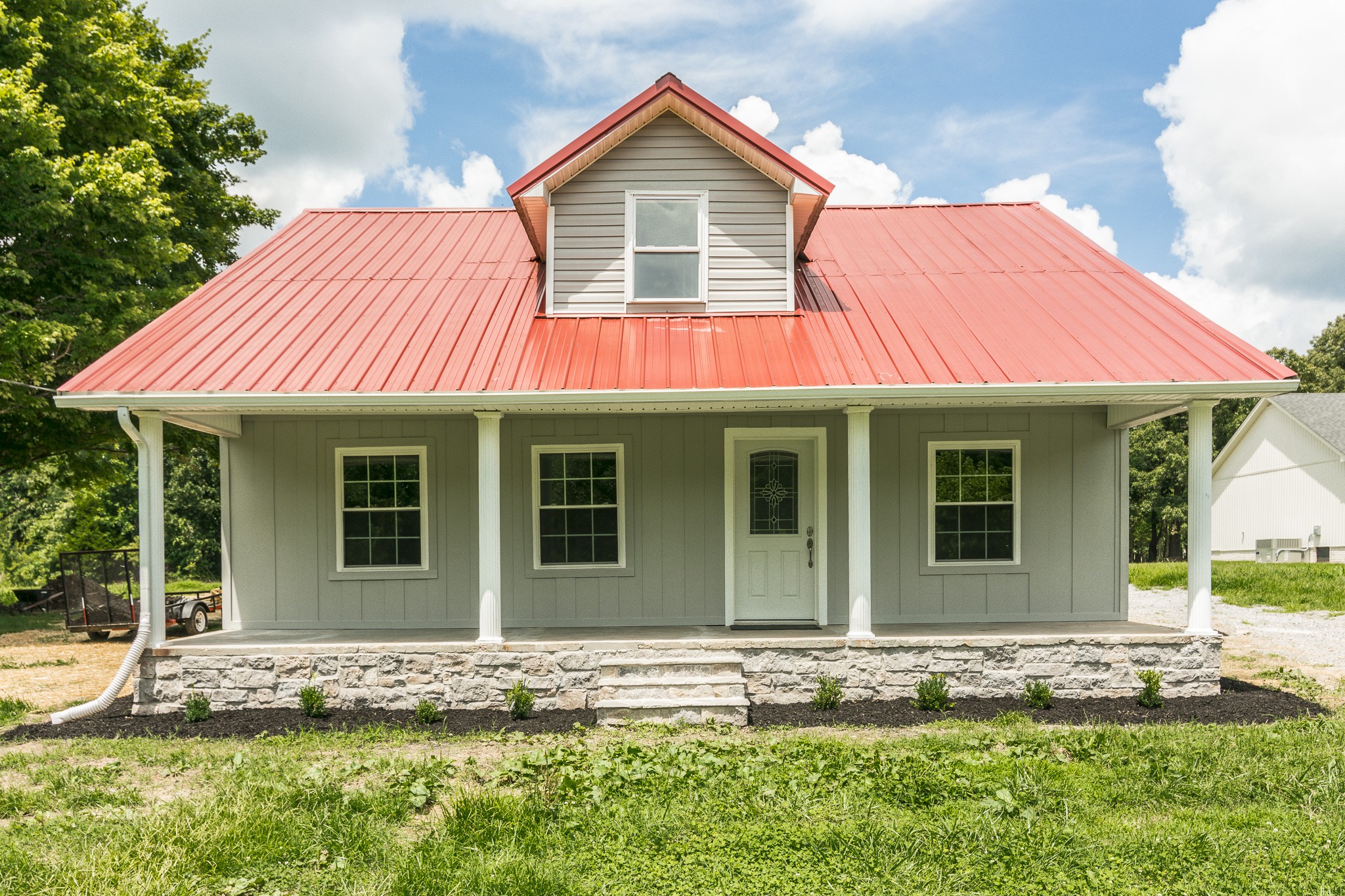 1267 Smiley Troutt Road Bethpage, TN 37022 - Photo 1 of 34 a front view of a house with garden