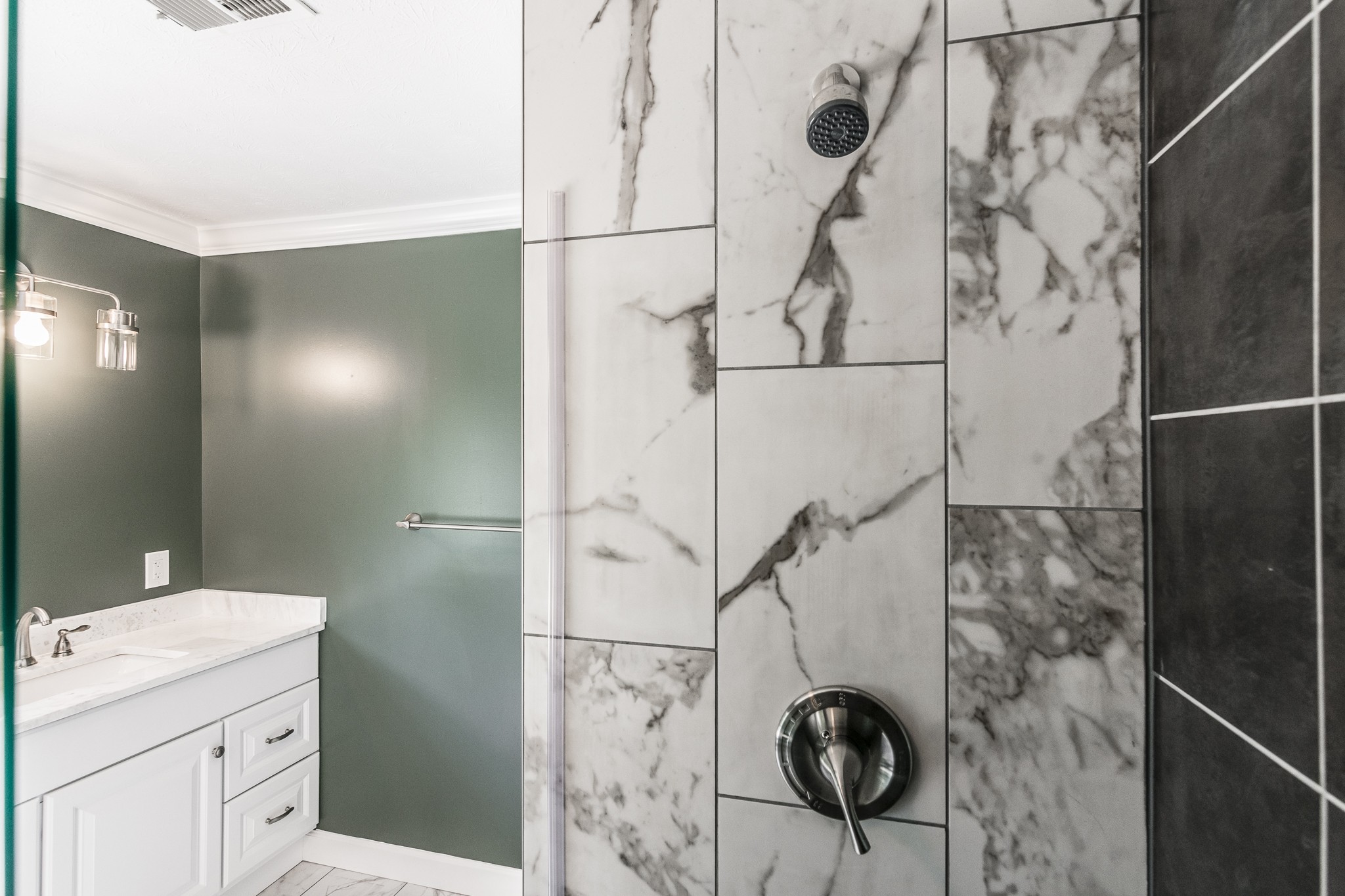 1267 Smiley Troutt Road Bethpage, TN 37022 - Photo 15 of 34 a bathroom with a granite countertop shower a sink and a toilet