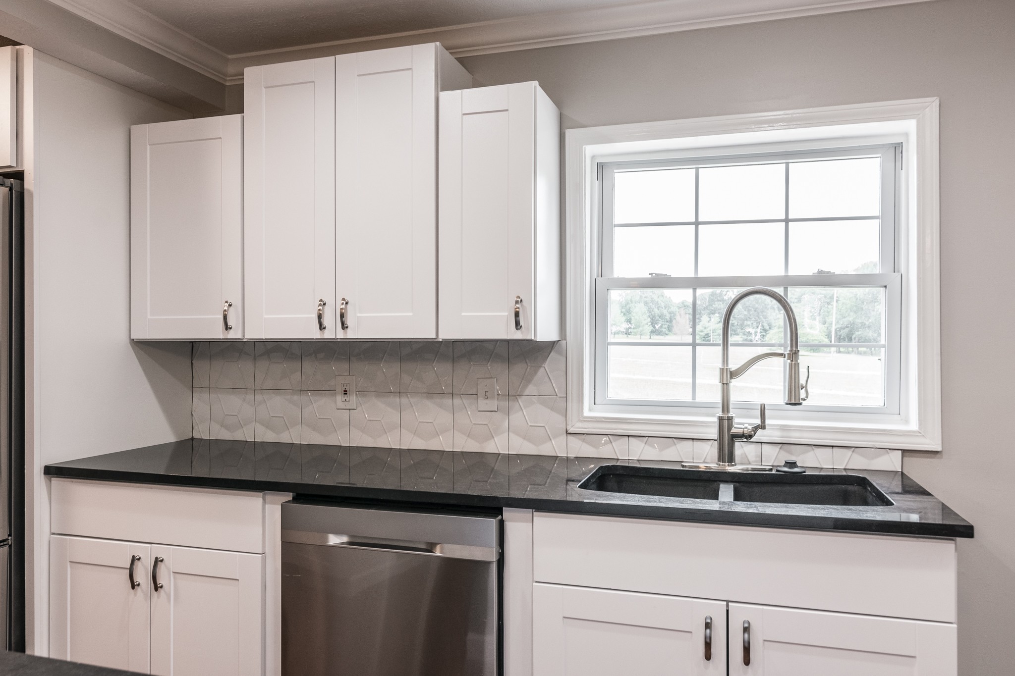 1267 Smiley Troutt Road Bethpage, TN 37022 - Photo 18 of 34 a kitchen with granite countertop a sink and a window
