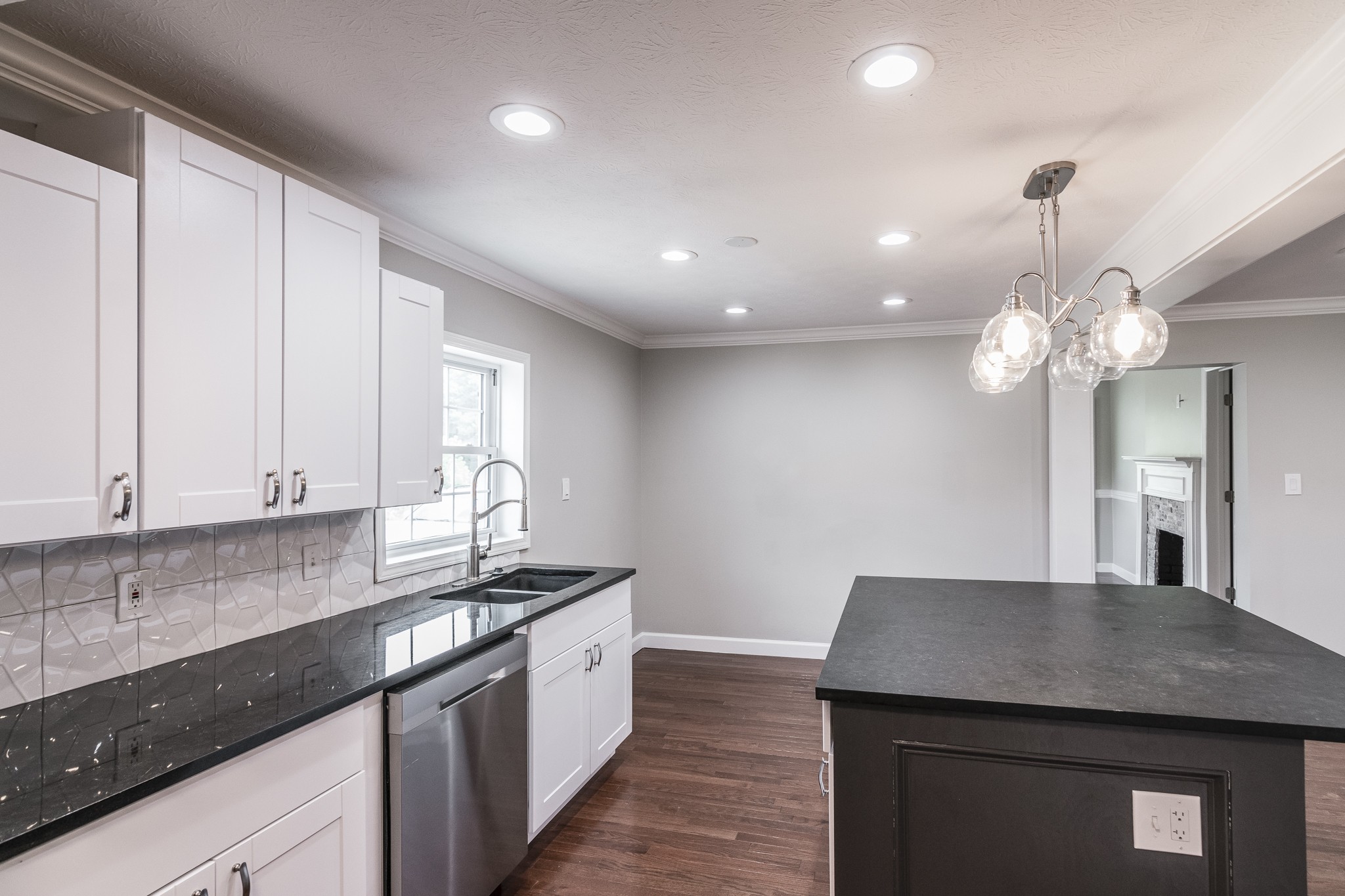 1267 Smiley Troutt Road Bethpage, TN 37022 - Photo 20 of 34 a kitchen with kitchen island granite countertop a sink a counter space appliances and cabinets