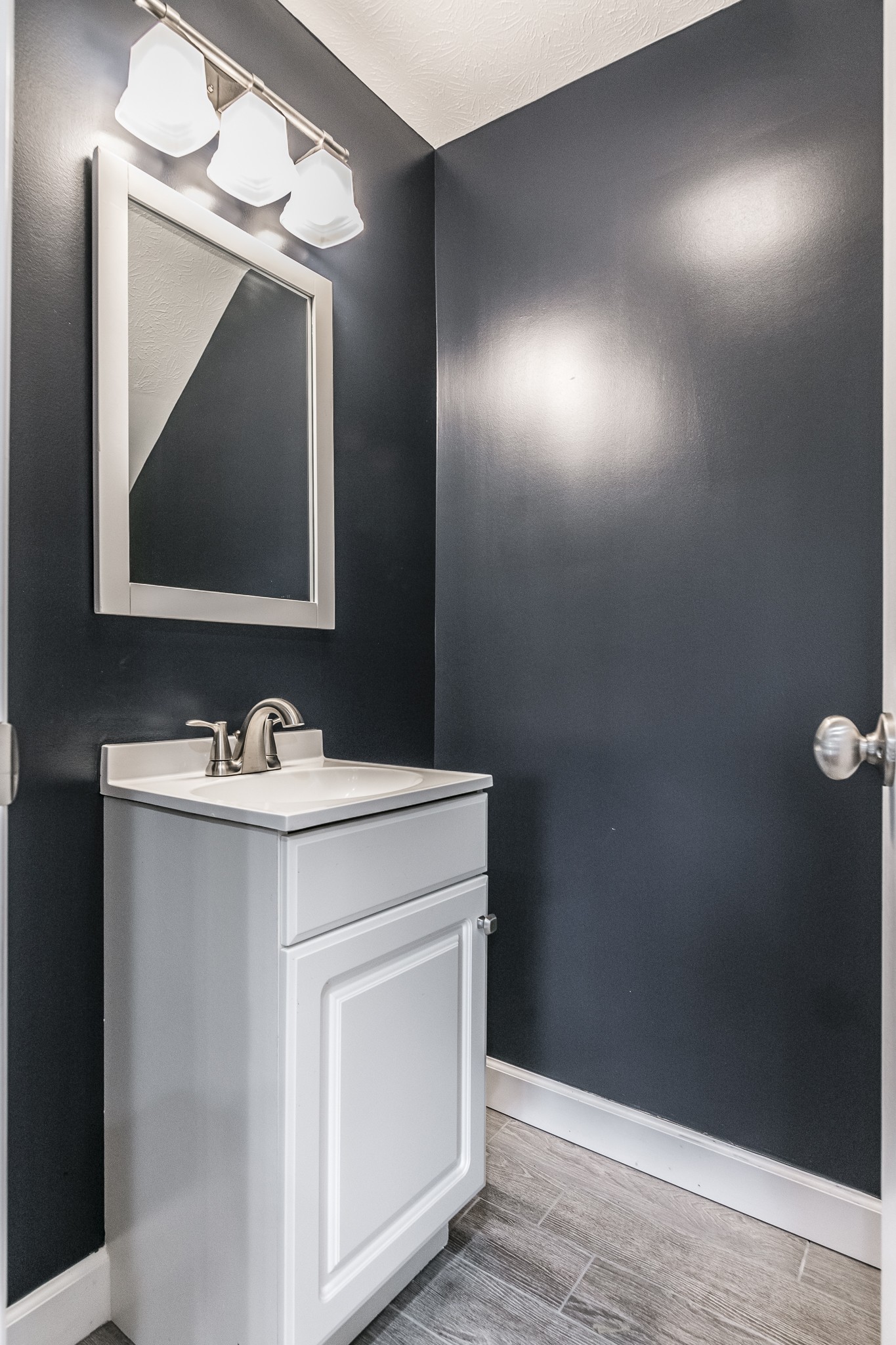 1267 Smiley Troutt Road Bethpage, TN 37022 - Photo 23 of 34 a bathroom with a sink and a mirror